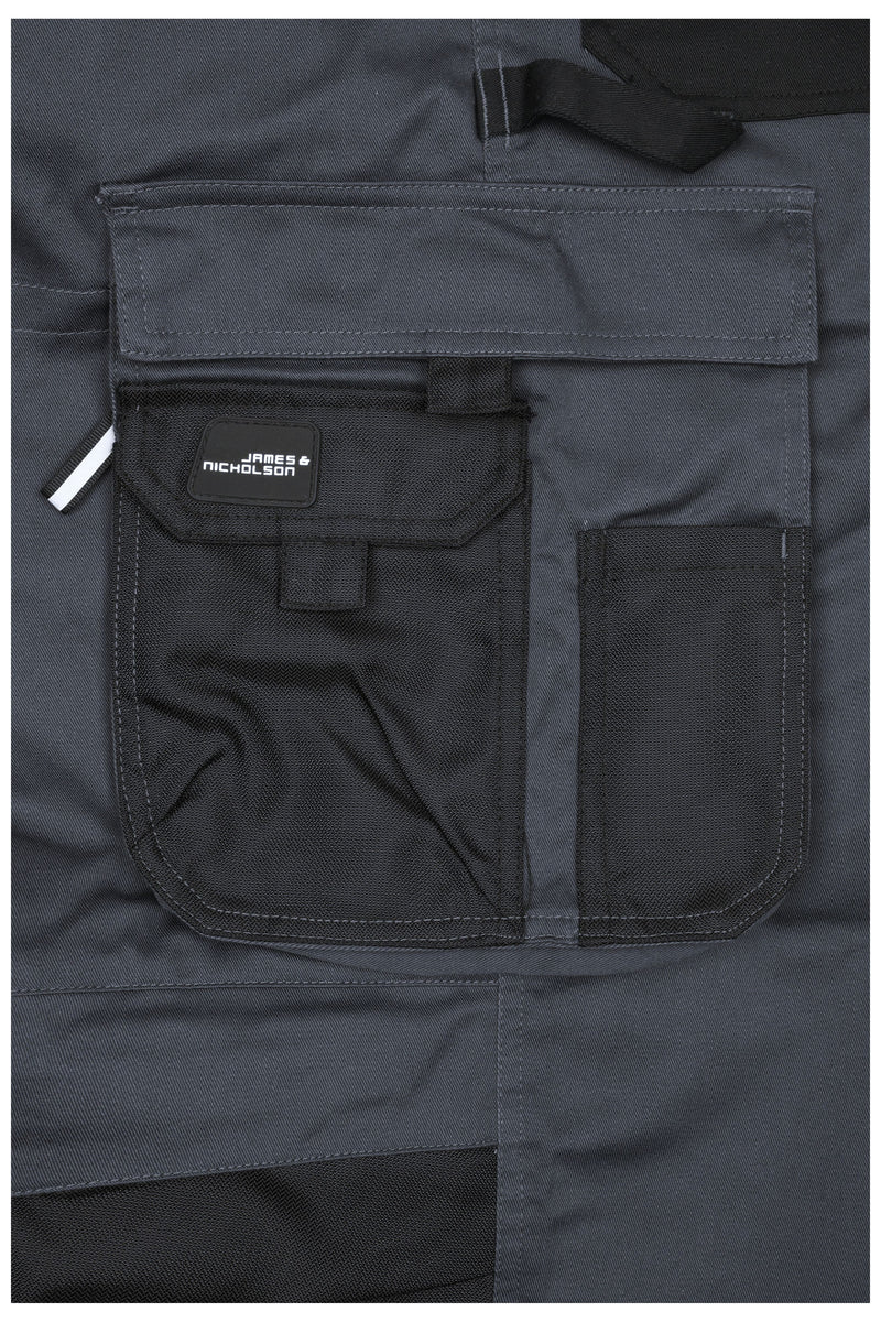 Laden Sie das Bild in Galerie -Viewer, Spezialisierte Latzhose mit funktionellen Details und flexibel einstellbarem, elastischen Bund - JN1833